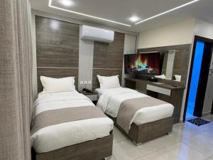 Postel nebo postele na pokoji v ubytování Golden Light Aqaba Hotel فندق جولدن لايت العقبة