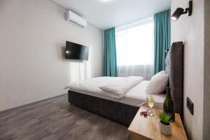 TV/trung tâm giải trí tại Nyvky Like Home - Manchattan City - Простора кв 335