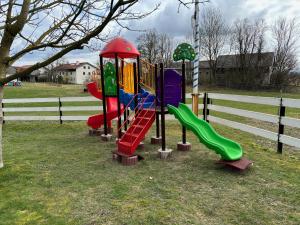 a playground with a slide in a park at Ferienhaus Spielburg in Altötting