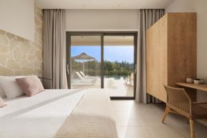 a bedroom with a bed and a view of a pool at My Mediterranean Luxury Villas,Corfu in Kontokali