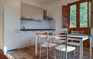 A kitchen or kitchenette at Lovely Apartment In Longobardi Marina
