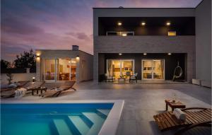 a house with a swimming pool in the backyard at Villa Katarina Privlaka in Privlaka +33 photos