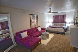 a living room with a couch and a bed at Las Vegas Oasis Home Primary in Las Vegas +23 photos