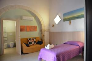 Postel nebo postele na pokoji v ubytování Relais Cimillà B&B