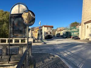 a mirror on a pole next to a street at Sangro River Casa Vacanza in Castel di Sangro +8 photos