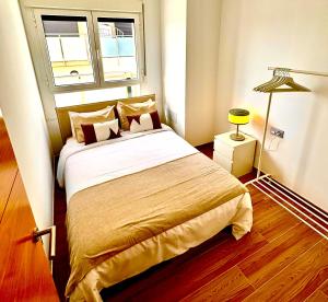 a bedroom with a bed in a room with a window at Golf villa heated pool relax tenerife south in San Miguel de Abona +22 photos