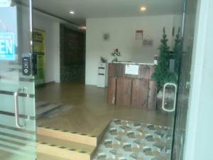 an empty room with a glass door with a floor at LE dEON HOTEL Former Pine Hotel in Batu Gajah