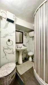 a small bathroom with a sink and a toilet at The Lovely House in Perugia