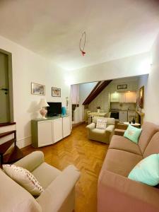 a living room with two couches and a tv at The Lovely House in Perugia +22 photos