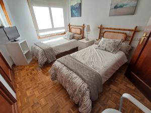 Postel nebo postele na pokoji v ubytování apartamento gran Vía