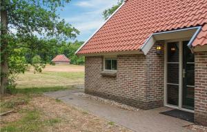 a brick house with a red roof at Hawar in De Bult +14 photos