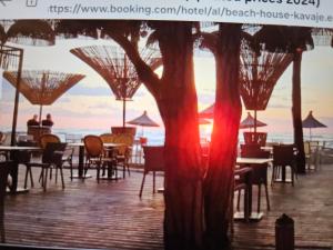 a view of a restaurant with tables and chairs at Marea Resort in Golem