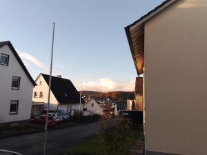 a view from the side of a house with a street at Ferienwohnung Volker Drews in Arnsberg +3 photos