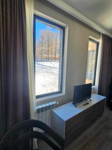 Televiisor ja/või meelelahutuskeskus majutusasutuses Vista Studio