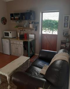 Kuchyň nebo kuchyňský kout v ubytování Voëlklip garden flat