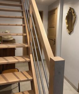 a staircase in a room with a wooden stair case at Le Chaufour Lille in Lille