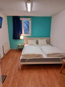 Postel nebo postele na pokoji v ubytování Bellpark Hostel