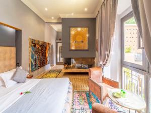 Postel nebo postele na pokoji v ubytování Le Medina Privilège Riad & Spa + 37 fotografií