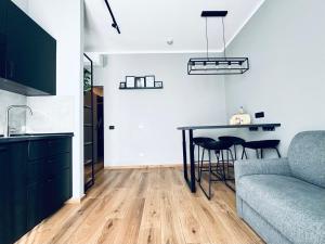 Posezení v ubytování M4 BLACK Monolocale Moderno e Funzionale