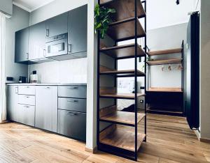 Kuchyň nebo kuchyňský kout v ubytování M4 BLACK Monolocale Moderno e Funzionale + 11 fotografií