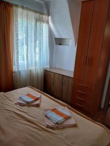 Postel nebo postele na pokoji v ubytování Rent a rooms - "Laki"