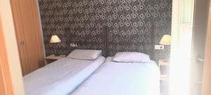 Posteľ alebo postele v izbe v ubytovaní Apartamentos MalagaSol