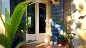 a door to a house with plants in front of it at Maison LeFleur - Villa avec piscine sur les hauteurs de Nice in Nice