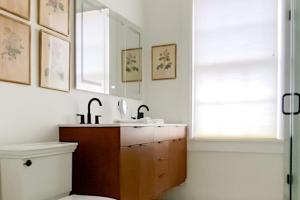 a bathroom with a sink and a toilet at East Wing of Captain's Mansion - Luxury, Waterfront, Town, & Beaches - 5 stars in Edgartown +28 photos
