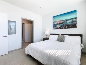 a white bedroom with a large white bed in a room at Your Dream Apartment Stay in Kissimmee +38 photos