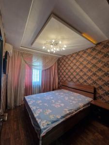 Ένα ή περισσότερα κρεβάτια σε δωμάτιο στο apartment Tashkent 1 bedroom