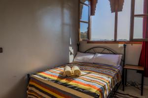Postel nebo postele na pokoji v ubytování Yakout hostel