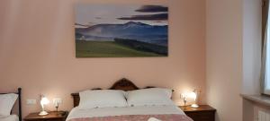 Postel nebo postele na pokoji v ubytování La Magnolia - Locazione Turistica