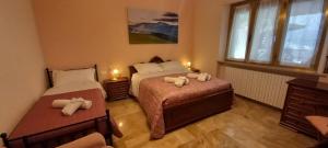 Postel nebo postele na pokoji v ubytování La Magnolia - Locazione Turistica