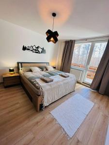 Posteľ alebo postele v izbe v ubytovaní Hagy Apartments