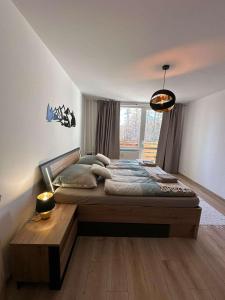 Posteľ alebo postele v izbe v ubytovaní Hagy Apartments