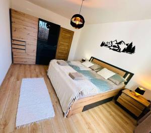 Posteľ alebo postele v izbe v ubytovaní Hagy Apartments