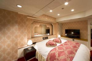 En eller flere senge i et værelse på HOTEL FIVE -Adult Only-