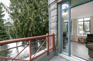 a balcony with a view of a tree at Alpenglow Lodge Bear Wonder One Bedroom by MVA in Whistler