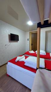 Postel nebo postele na pokoji v ubytování Akelvani Guest House