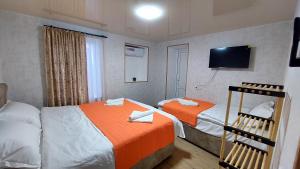 Postel nebo postele na pokoji v ubytování Akelvani Guest House