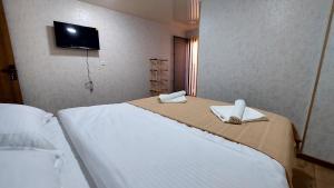 Postel nebo postele na pokoji v ubytování Akelvani Guest House
