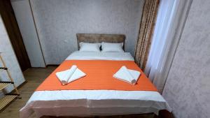 Postel nebo postele na pokoji v ubytování Akelvani Guest House