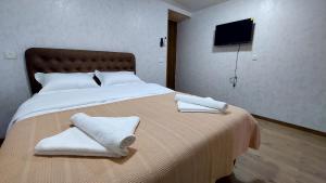 Postel nebo postele na pokoji v ubytování Akelvani Guest House