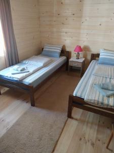 Postel nebo postele na pokoji v ubytování Rent a rooms - "Laki"