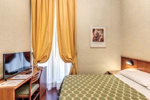 TV a/nebo společenská místnost v ubytování Hotel Corona