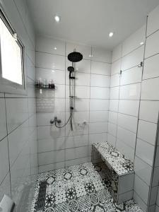 a bathroom with a shower with a tiled floor at Modern appartement in Agadir in Agadir +41 photos