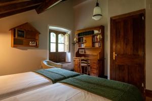 Postel nebo postele na pokoji v ubytování Casa María Berna