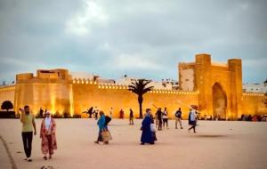 a group of people walking in front of a building at Riad Dar Chaafa 17 in Salé