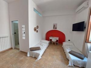 a hospital room with two beds and a sink at Dimora la Motta in Modugno