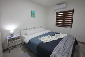 Ένα ή περισσότερα κρεβάτια σε δωμάτιο στο Ivan's guesthouse